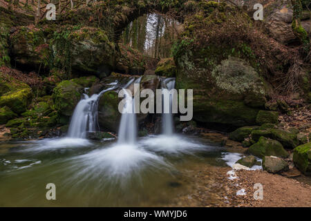 The Schiessentümpel is a small and picturesque waterfall on the Black Ernz river. Mullerthal - Luxembourg’s Little Switzerland. Stock Photo