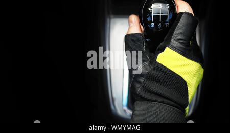 Gear lever. Manual Transmission. Hand on the gear shift in the car. Stock Photo
