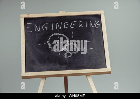 Engineering word handwritten on chalkboard. Gray background Stock Photo