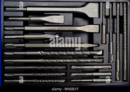 Closeup of drill bits of different size in blue toolbox. Stock Photo