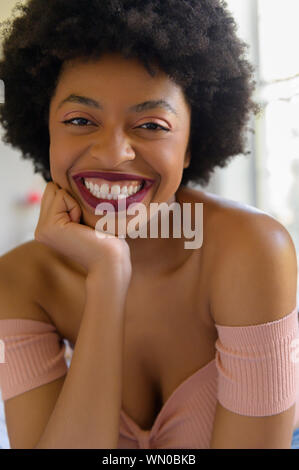 Portrait of smiling young woman wearing lipstick Stock Photo