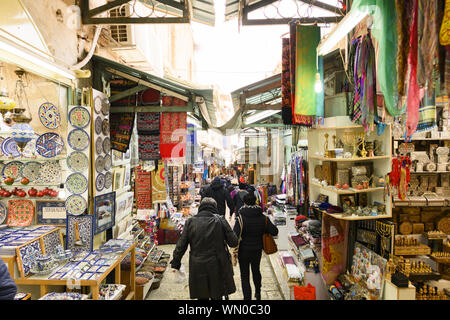 Locals and tourists at the Mahane Yehuda Market on a busy Friday. Mahane Yehuda Market often referred to as 'The Shuk is a marketplace in Jerusalem. Stock Photo