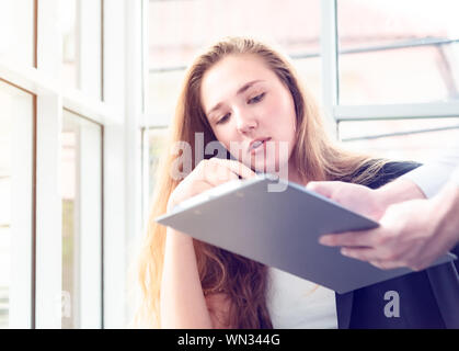 Teamwork business concept .Start up business people in modern office, working together having success. Multiethnic start-up business team on meeting i Stock Photo