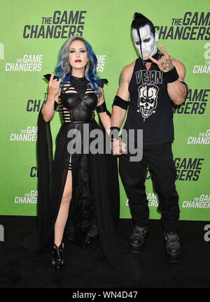 HOLLYWOOD, CA - SEPTEMBER 04: Alissa White-Gluz (L) and Doyle Wolfgang von Frankenstein attend the LA Premiere Of 'The Game Changers' at ArcLight Hollywood on September 04, 2019 in Hollywood, California. Stock Photo