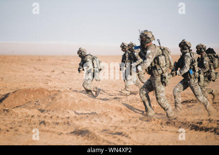 Coalition Special Forces Operators run towards an objective after exiting a Jordanian helicopter while conducting a scenario during Exercise Eager Lion 2019 near the Sahab District, Hashemite Kingdom of Jordan, Sept. 3, 2019. Eager Lion, U.S. Central Command's largest and most complex exercise, is an opportunity to integrate forces in a multilateral environment, operate in realistic terrain and strengthen military-to-military relationships. (U.S. Air Force photo by Senior Airman Sean Campbell)