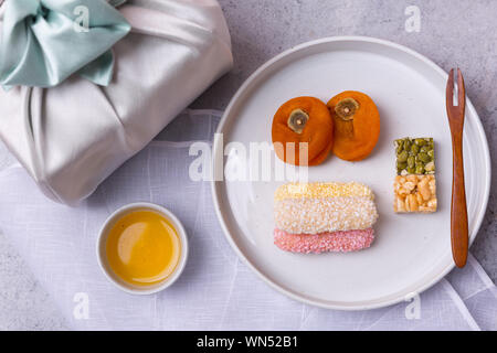 Concept of Korean traditional objects, wrapping cloth and refreshments. 072 Stock Photo