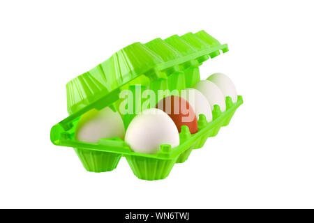 Dozen eggs white and one brown or red in open green plastic package on white background isolated close up side view, eco friendly design, healthy food Stock Photo