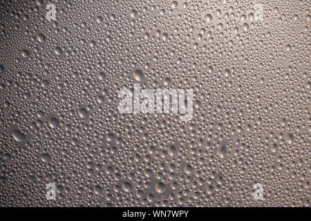 Water droplets condensation background on glass surface, abstract gray texture with moisture, macro pattern for humidity and freshness concept Stock Photo