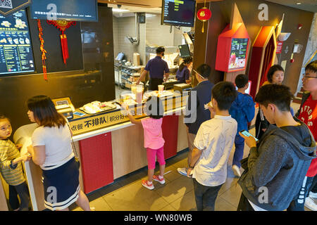 SHENZHEN, CHINA - CIRCA FEBRUARY, 2019: people at McDonald's restaurant. Stock Photo