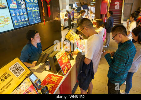 SHENZHEN, CHINA - CIRCA FEBRUARY, 2019: people at McDonald's restaurant. Stock Photo