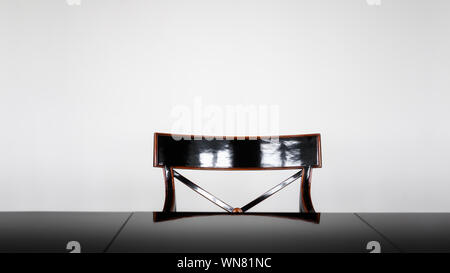 Modern office or living room interior with black table and chair against white wall Stock Photo