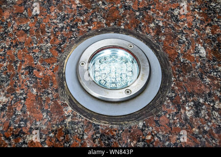 LED backlight in granite stone. Light fixture. Stock Photo