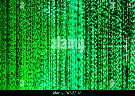 Green neon lights background, abstract glitter bright light close up, club festive party poster design, holiday blinking backdrop, beautiful sparks Stock Photo