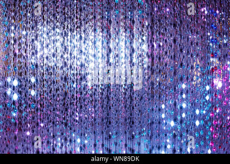 Violet neon lights background, abstract glitter bright light closeup, club festive party poster design, holiday blinking backdrop, beautiful sparks Stock Photo