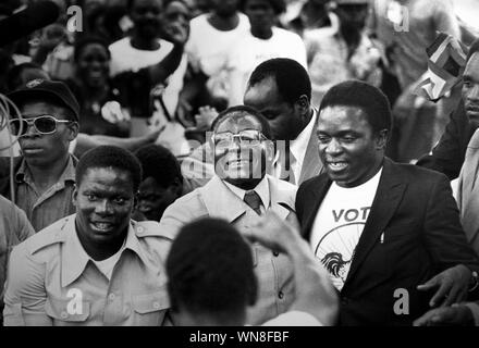 FILE: Robert Mugabe has passed away. 6th September, 2019. Robert Mugabe arrives back in (Salisbury Rhodesia), Harare Zimbabwe from exile in 1980. Emerson Mnangagwa the new President of Zimbabwe is on the left of Mugabe COPYRIGHT PHOTOGRAPH BY BRIAN HARRIS  © 07808-579804 Credit: BRIAN HARRIS/Alamy Live News Stock Photo