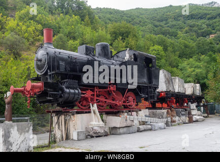CARRARA, ITALY - AUGUST 23, 2019: Old locomotive, train engine, near the marble quarries at Fantiscritti, Carrara. Once used to transport marble. Stock Photo