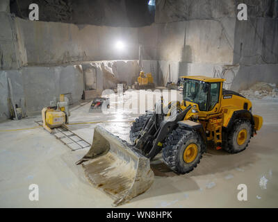 MASSA CARRARA, ITALY - AUGUST 23, 2019: Most marble quarries are open cast type but some are underground. Here is inside one. Stock Photo