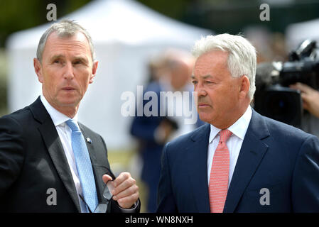 Nigel Evans MP (Con: Ribble Valley) talking to Sir Alan Duncan (Con: Rutland and Melton) on College Green, Westminster, before a historic Brexit vote Stock Photo