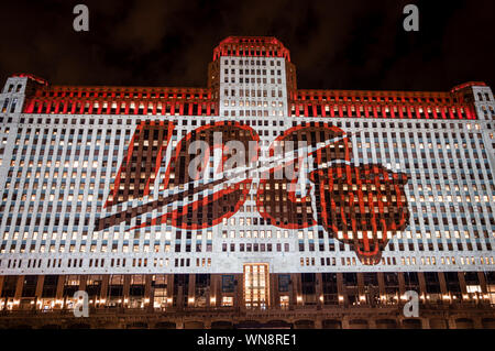 Chicago, USA-September 5, 2019: The Merchandise Mart is celebrating the 100th playing season of the Chicago Bears NFL with projected wall art at night Stock Photo