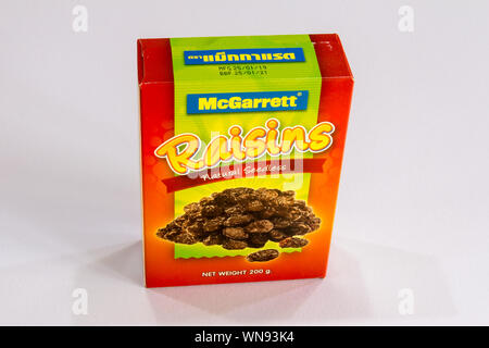 Phuket, Thailand - August 1st 2019: a Cardboard box of McGarrett natural seedless raisins. They are made from dried grapes. Stock Photo