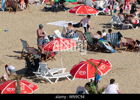 Clacton   United Kingdom 23 August  2019  -:  Holidaymakers on Clacton beach Stock Photo