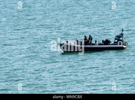 Clacton   United Kingdom 23 August  2019  -:  Inflatable Border patrol boat on calm sea Stock Photo