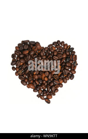 Heart shape made with fresh roasted coffee beans isolated on white background Stock Photo