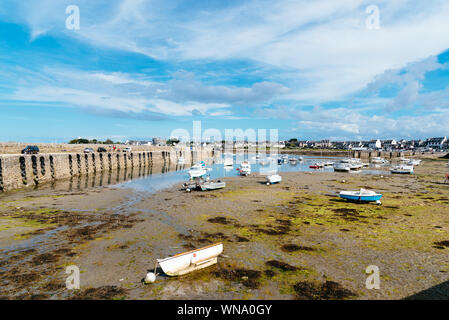 Roscoff, France - July 31, 2018: Stranded ships at low tide in the harbour a sunny day of summer Stock Photo