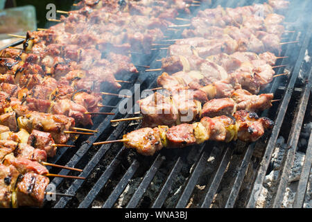 Process of cooking called Shashlyk or pork kebab meat dish on grill Stock Photo