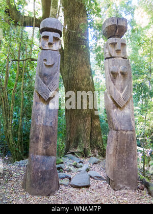 Wooden statue, in the middle of the Huilo Huilo Biological Reserve, regressing animals and Mapuche mystical characters from southern Chile. Los Rios R Stock Photo