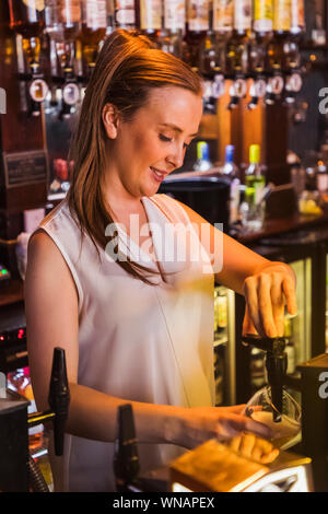 England, London, Southwark, Bermondsey, Barmaid In the Anchor Tap Sam Smiths Pub Stock Photo