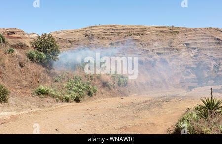 Smoking out rodents, protecting the local crops, Madagascar Stock Photo