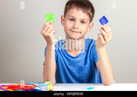 Child creating with 3d printing pen new object Stock Photo