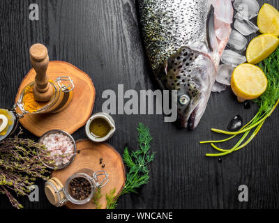 Composition with fresh raw salmon on table with cooking ingredients, top view Stock Photo