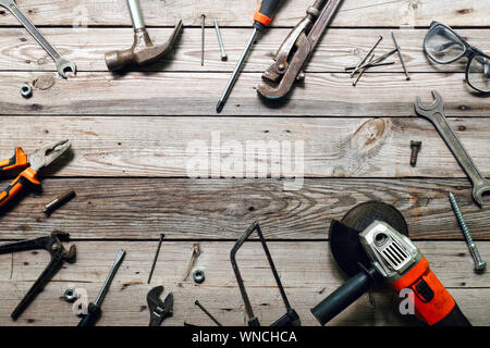 Flat lay composition with vintage carpentry tools on rough 