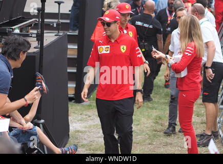 Monza, Italy 5 September 2019: Sebastien Vettel is among his fans and givings autograph in Monza circuit paddock. Stock Photo