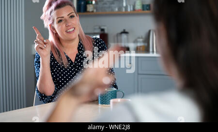 Close UpOf Woman Having Conversation At Home Using Sign Language Stock Photo
