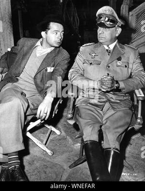 Director BILLY WILDER and ERICH von STROHEIM as Field Marshal Erwin Rommel on set candid filming FIVE GRAVES TO CAIRO 1943 screenplay Charles Brackett and Billy Wilder Paramount Pictures Stock Photo