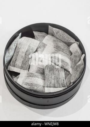 Swedish snus on white background with black box Stock Photo