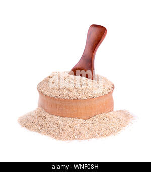 Wheat bran in a small wooden bowl, isolated on white. Wheat germ, the highly nutritious heart of the wheat kernel. Good nutrition for weight loss and Stock Photo