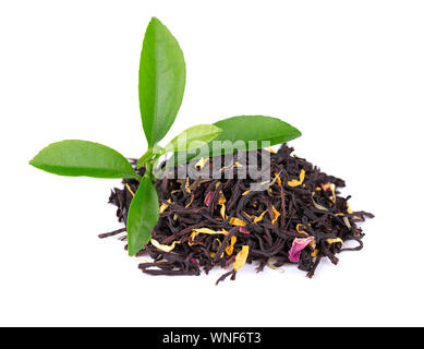 Black ceylon tea with rose petals, cornflowers and sunflower, isolated on white background Stock Photo