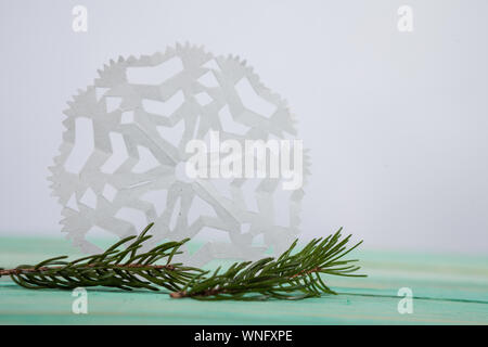Paper snowflake and tied with twine Stock Photo