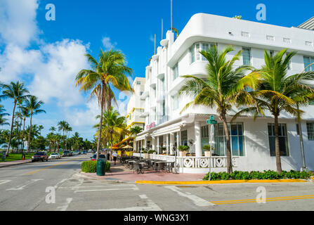 MIAMI - JULY 15, 2017: Empty tables await breakfast crowds at the sidewalk cafes lining Ocean Drive in South Beach. Stock Photo