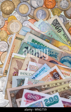 International currency - banknotes and coins from around the world. Stock Photo