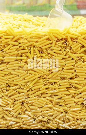 Pasta Vermicelli pasta texture background. filmed in store. scoop for bulk materials. self-service point