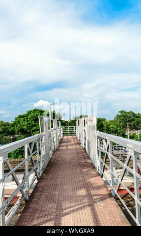 Railway foot over bridge or simply called an Over bridge on a railway station platform almost complete for passengers to pass over a railway station p Stock Photo