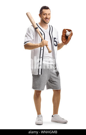 Full length portrait of a guy holding a baseball bat and a ball in a glove smiling at the camera isolated on white background Stock Photo