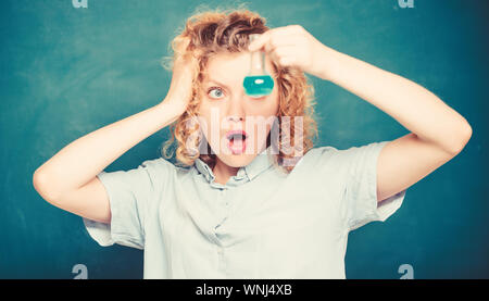 biology experiment. sample formula. surprised student with beaker. chemistry research results. girl hold chemical flask with liquid. scientist at school lab. school lesson. Educational concept. Stock Photo