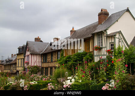 Le Bec-Hellouin, Haute-Normandie, typical timbered houses and lots of colourful flowers Stock Photo