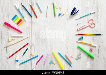 Back to school concept, creative layout with with various school supplies and stationery on wooden background. Flat lay style composition, top view, o Stock Photo